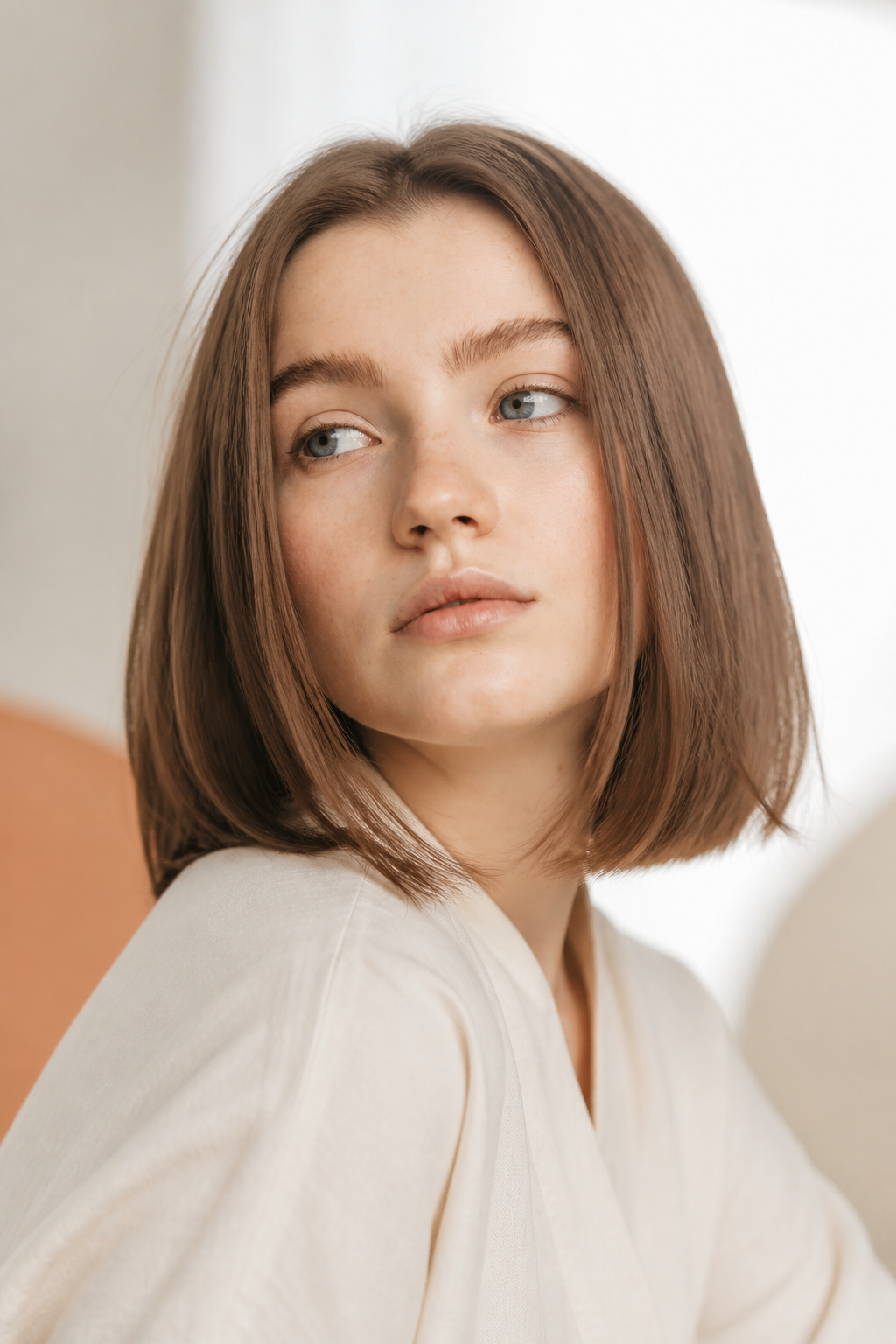 fall hair colors for fair skin and blue eyes: cool ashy brown in an original editorial composition