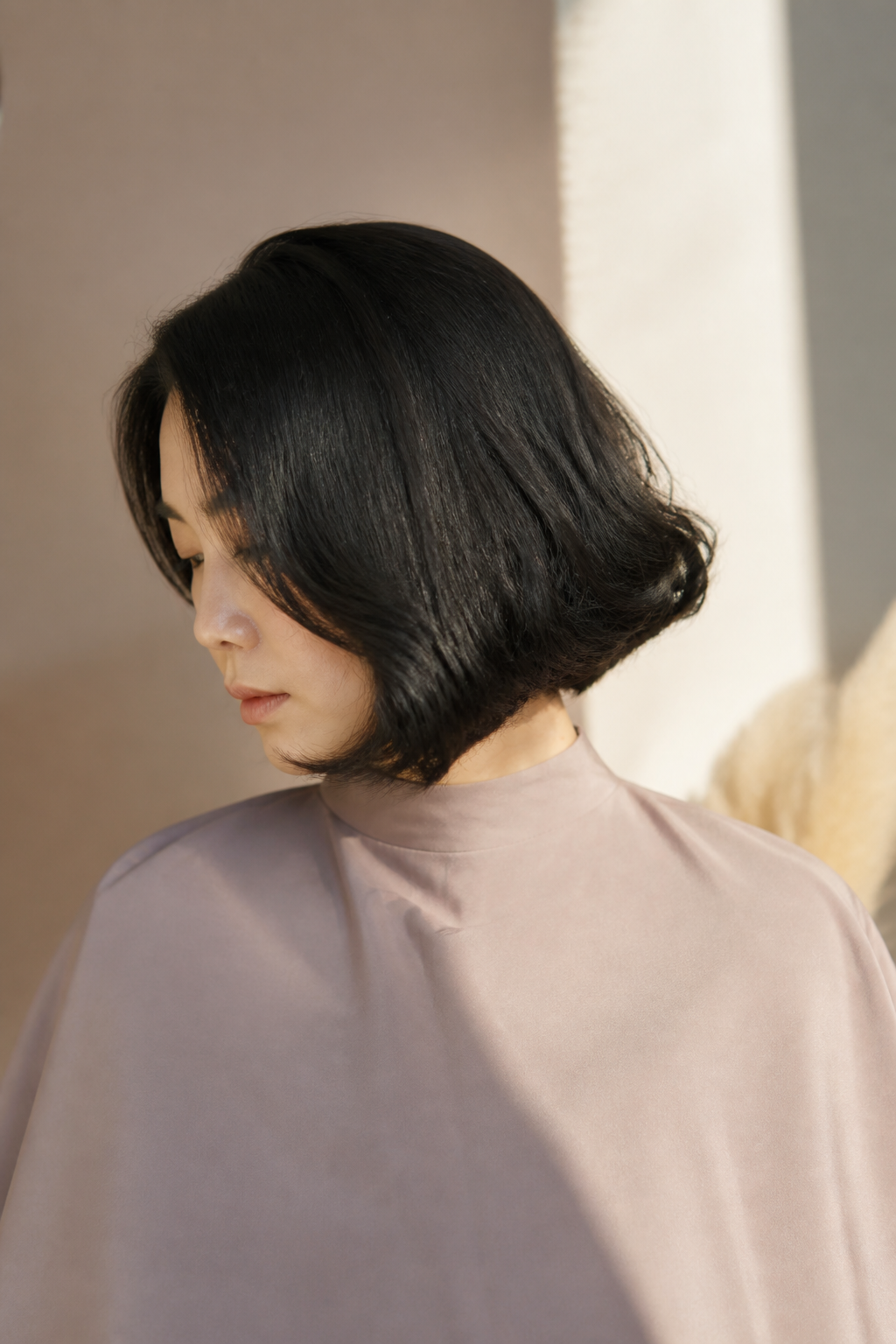 fall old money bob hairstyles: deep side-part bob in an original editorial composition
