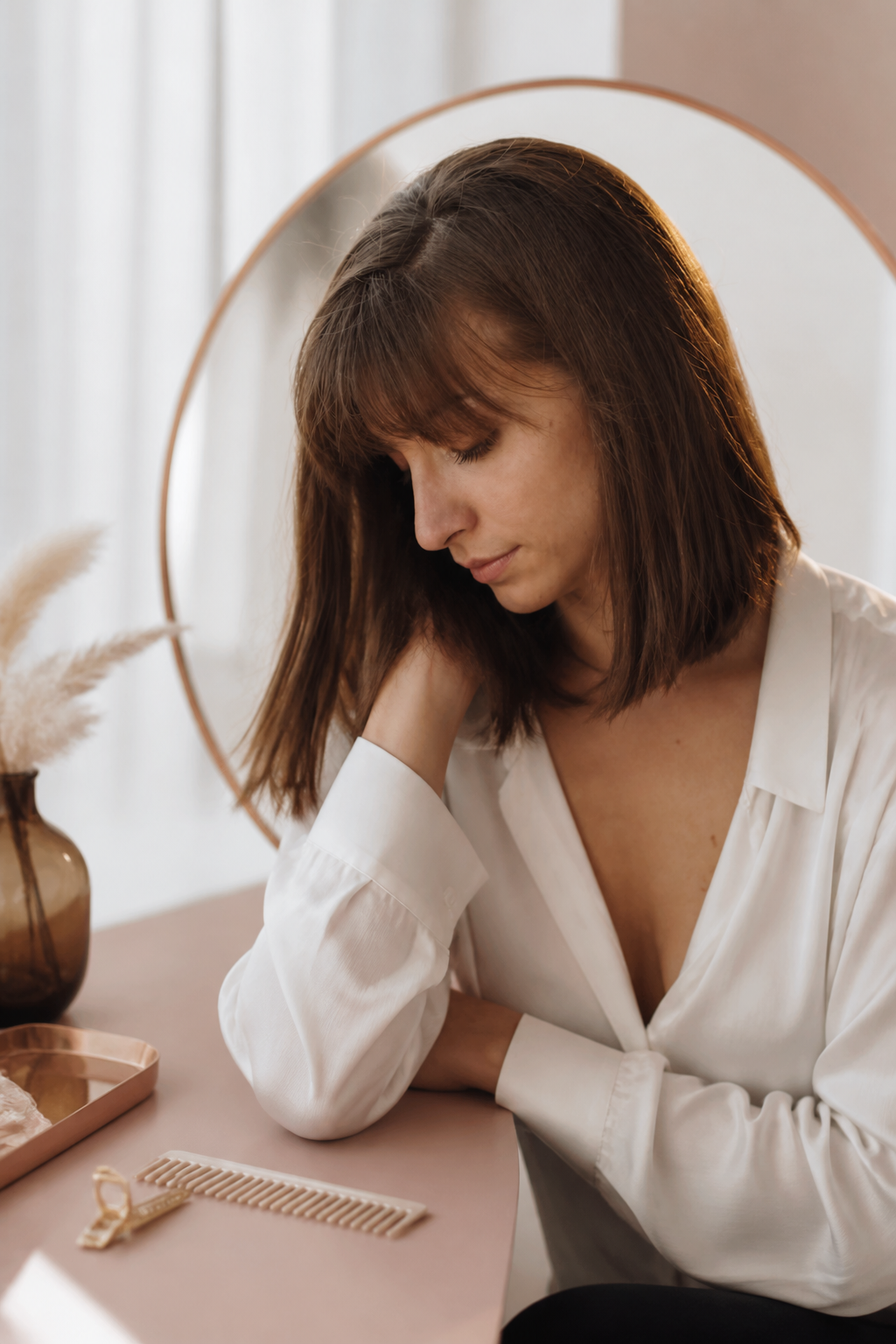 old money brunette bob hairstyles: brunette bob with bangs in an original editorial composition