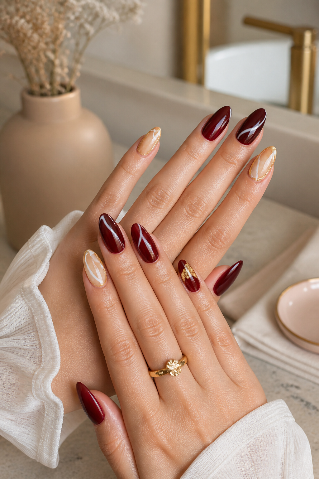 rich burgundy and warm stone marble nails