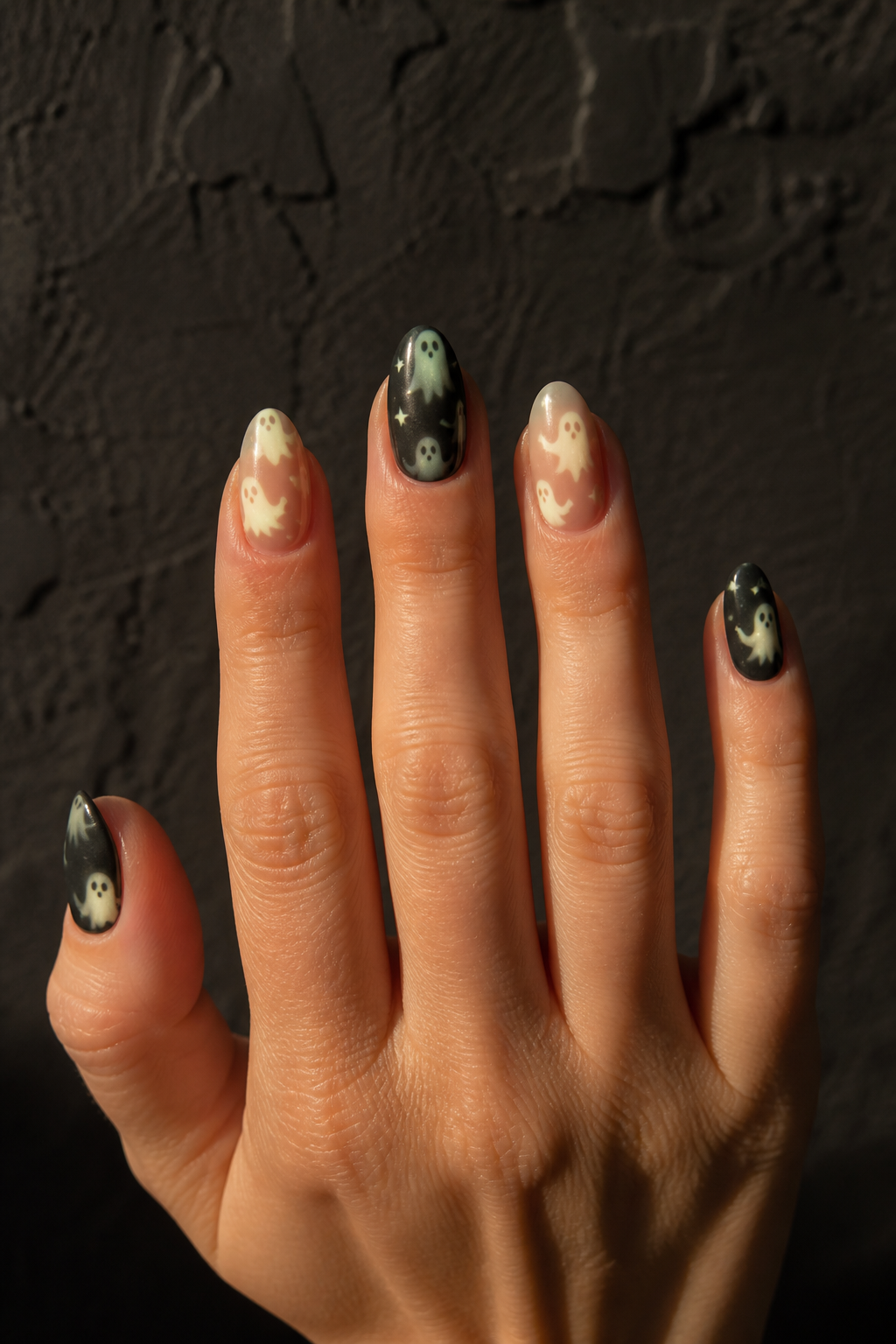 Glow Ghosts ghost manicure shown from a distinct editorial hand pose