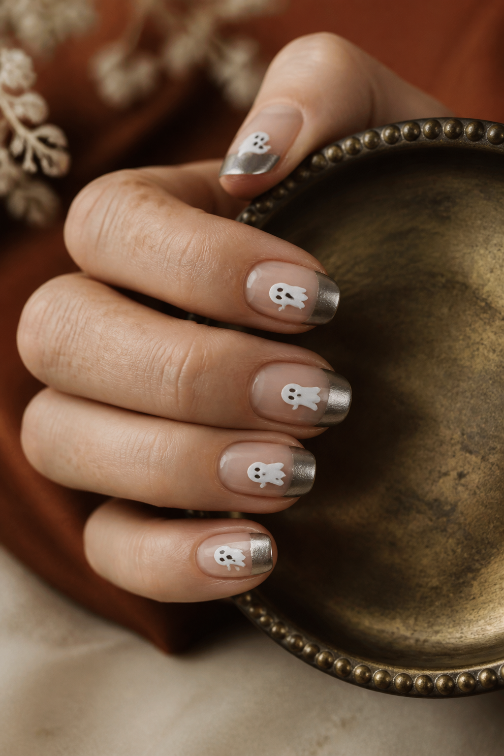 Chrome Ghosts ghost manicure shown from a distinct editorial hand pose