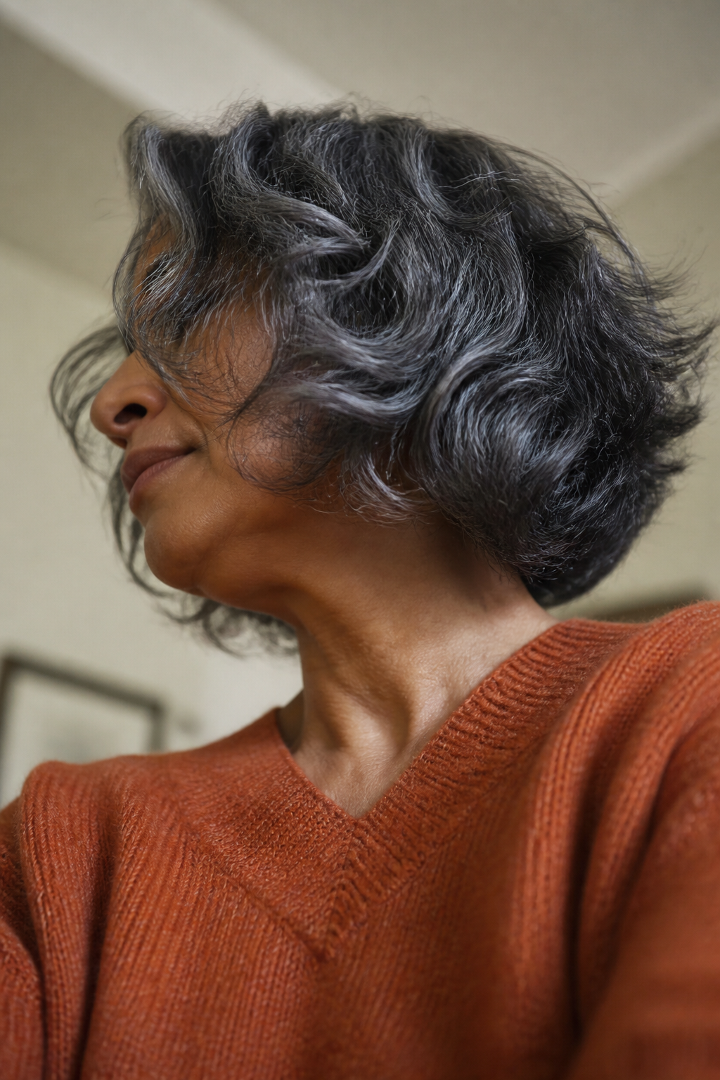 Chin Length Gray Curls hairstyle shown in a realistic hair-focused editorial view