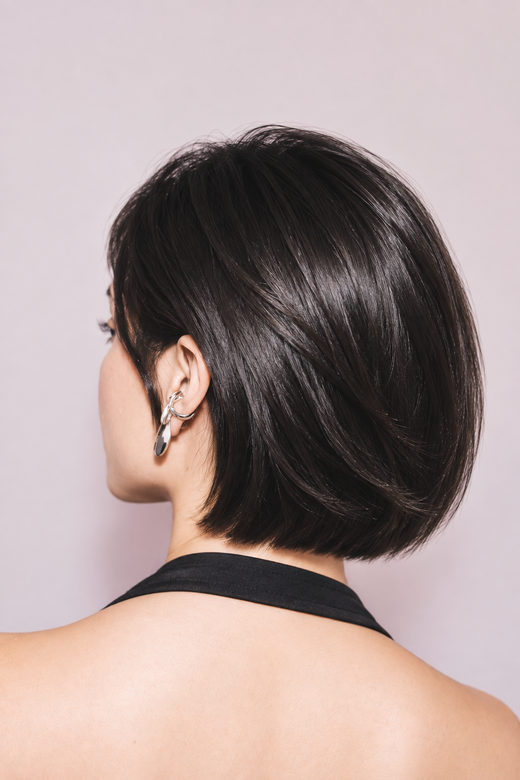 short ear length hairstyles: polished tucked bob