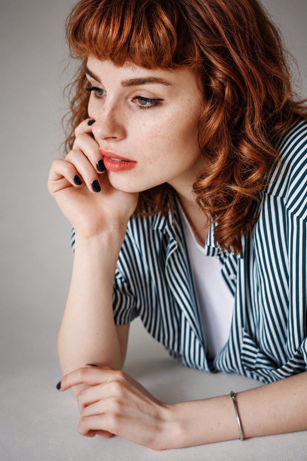 lob with bangs: curly lob with short textured bangs