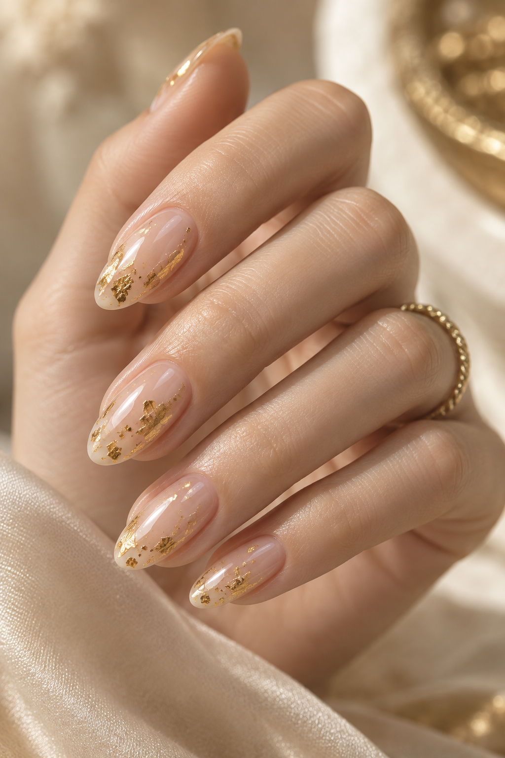 subtle nail ideas: transparent nails with gold foil