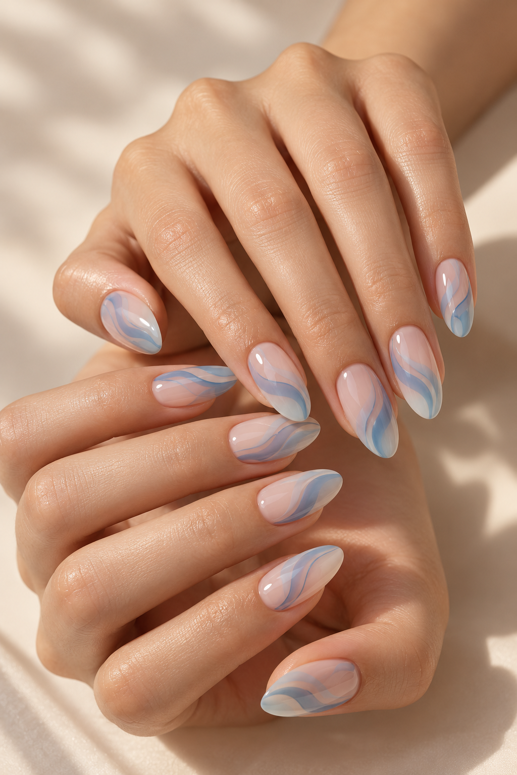 April nail ideas: soft blue waves with sheer neutrals